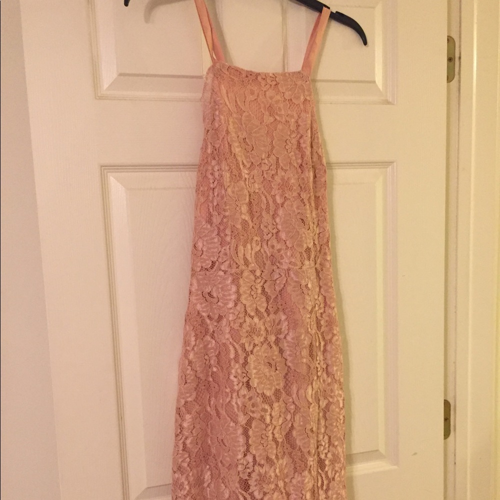 Satin strap peach lace dress.